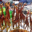 Hand-made Giraffe sculpture among the many items on sale.